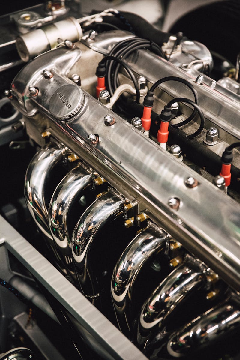 Detailed view of a polished chrome engine, showcasing luxury automotive design.